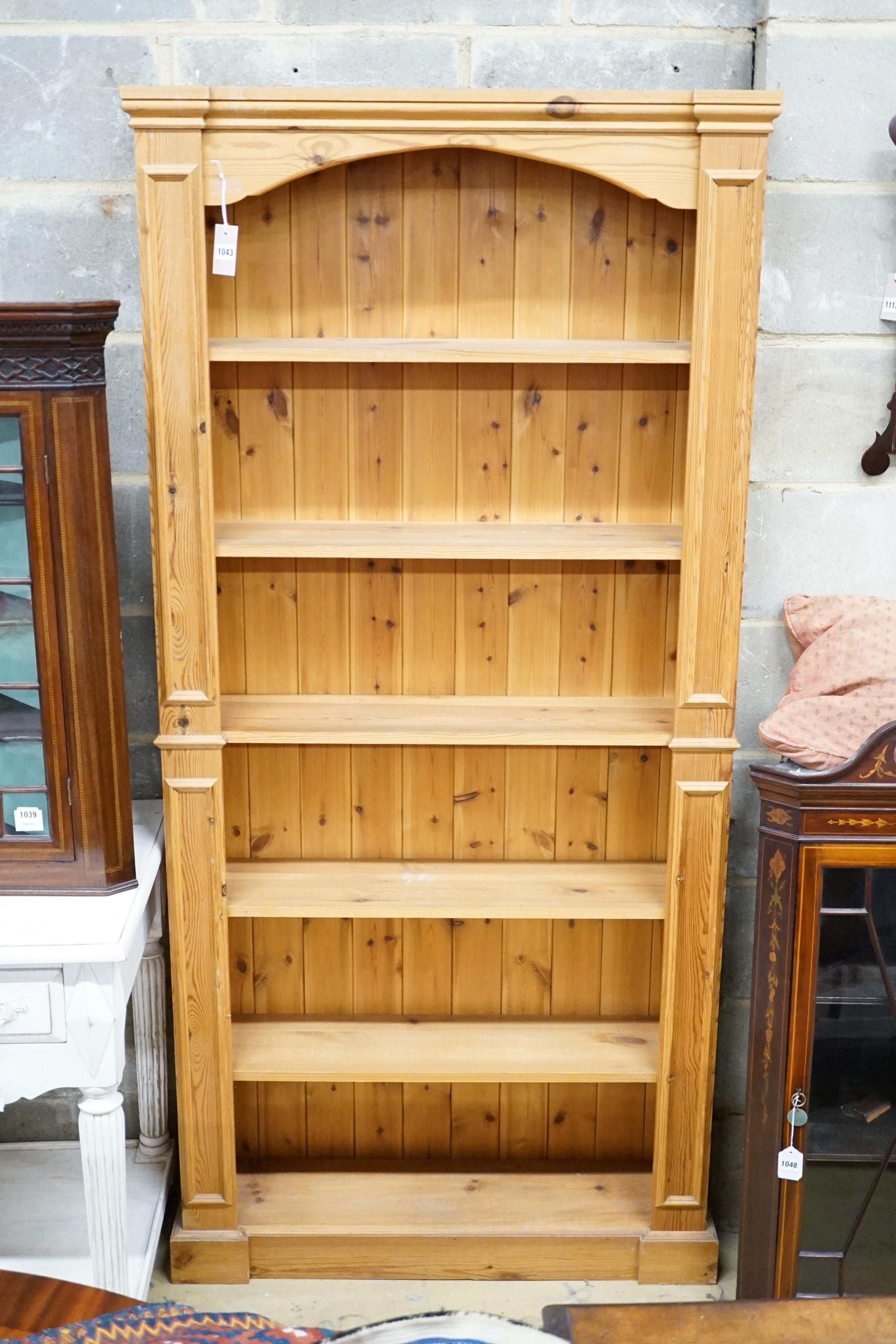 A modern tall pine bookcase, length 94cm, depth 24cm, height 196cm